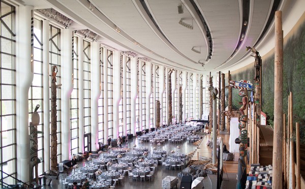 A large room with tables and chairs in it.