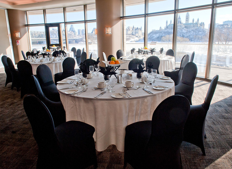 A large room with tables and chairs set up.