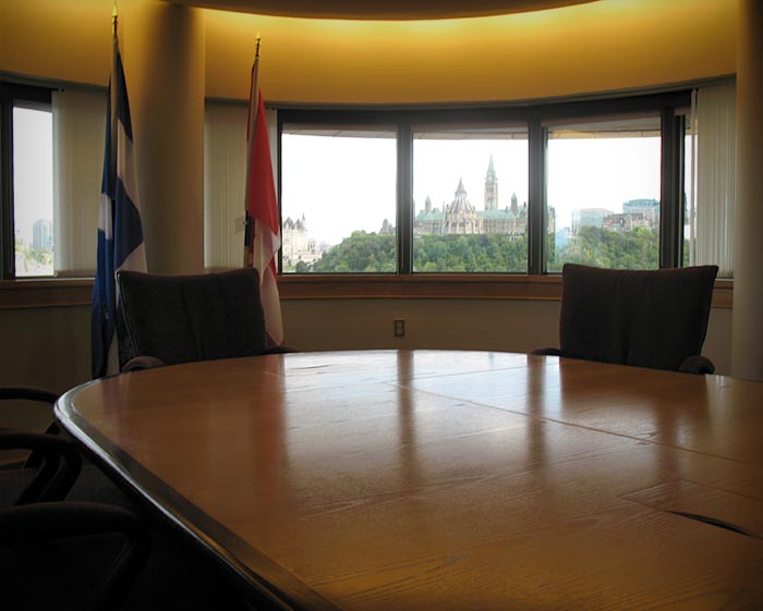 An executive conference table in a boardroom.