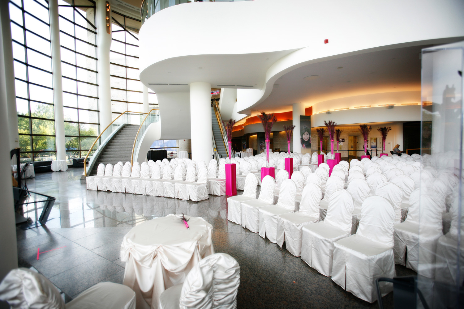 A wedding ceremony set up in a large open space.