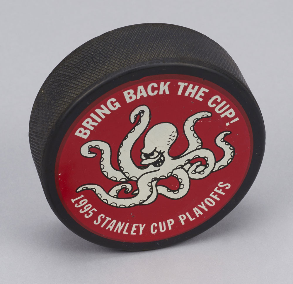 John Finley, former team doctor for the Detroit Red Wings, kept this Viceroy Rubber puck from the 1995 playoffs. The team did not “bring back the cup” that year, losing to the New Jersey Devils in the Stanley Cup Finals. Photo: Canadian Museum of History. 