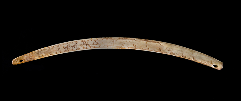 Nuvumiutaq was buried with his hunting equipment, including a bow-drill incised with scenes that may illustrate events from his personal life. Muscle and trauma marks on his skeleton corroborate the picture of a skilled kayaker and hunter who lived an eventful life. Photo: Canadian Museum of History