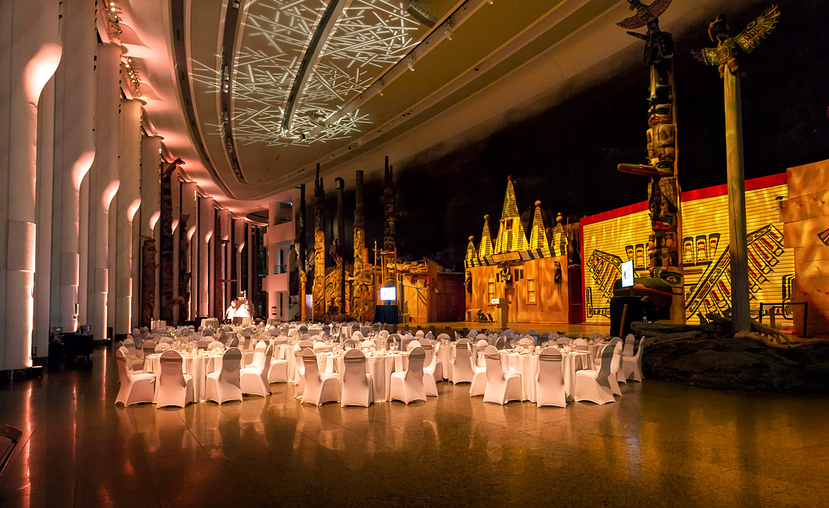 A large room with white tables and chairs located at the Canadian Museum of History in Ottawa.