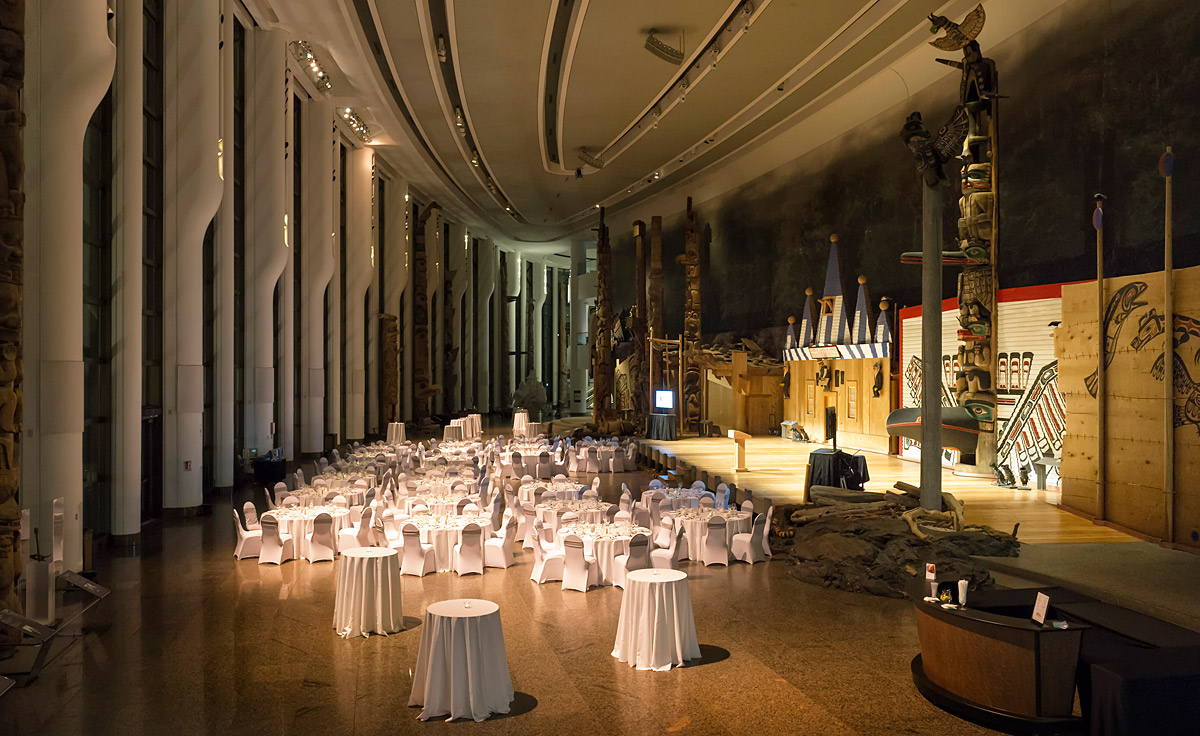 A large room with white tables and chairs located at the Canadian Museum of History in Ottawa.