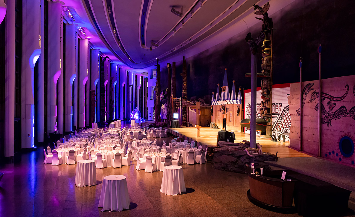 A large room with tables and chairs set up for an event at the Canadian Museum of History in Ottawa.