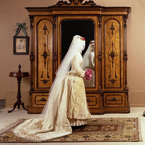 A mannequin standing in front of a mirror in the Canadian Museum of History.