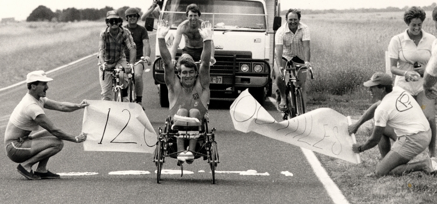 A group of people holding signs on the side of a road in Ottawa.