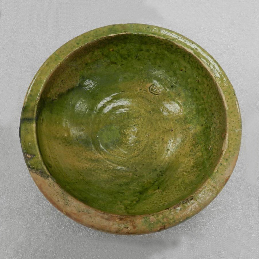 A green bowl on a white surface in Ottawa.