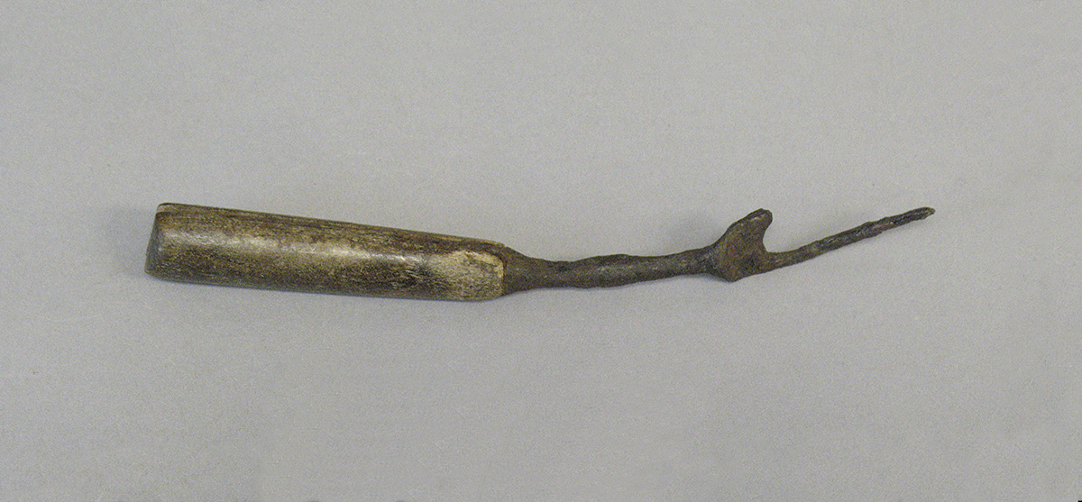 A piece of metal on a white surface in the Canadian Museum of History, in Ottawa.