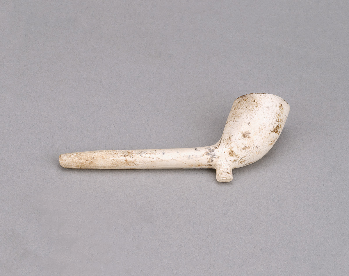 A white pipe on a gray surface at the Canadian Museum of History in Ottawa.