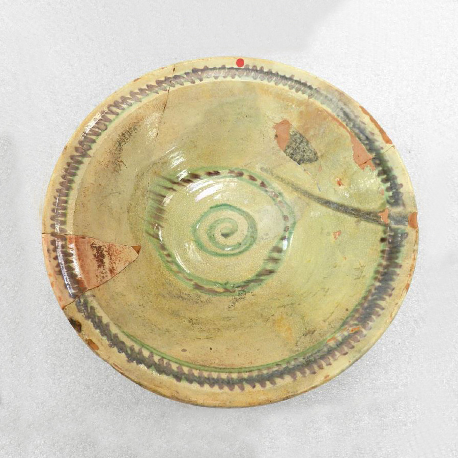 A bowl with a spiral design on it, found in Ottawa's Canadian Museum of History.