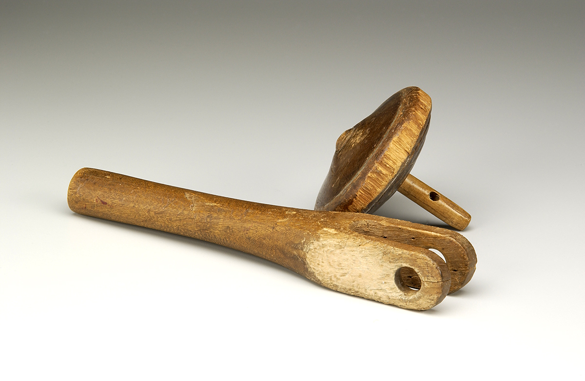 Two wooden spoons on a white surface at the Canadian Museum of History in Ottawa.