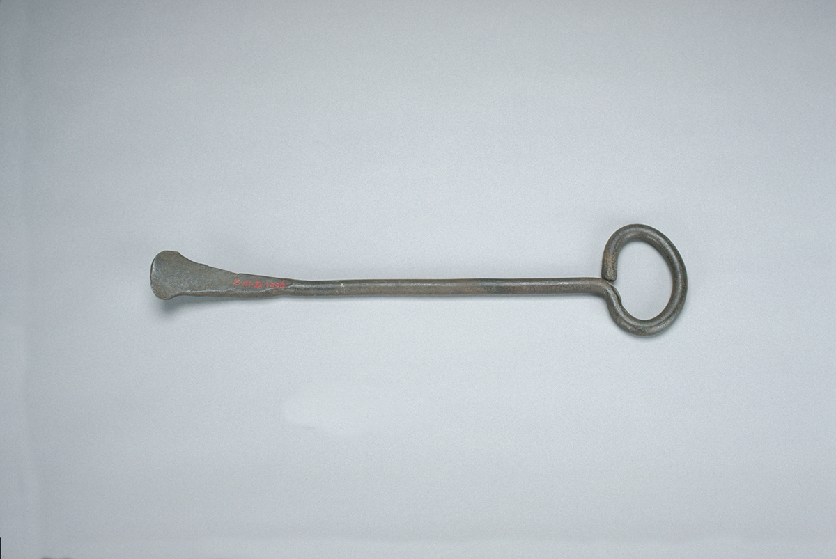 A metal object on a white surface in the Canadian Museum of History, Ottawa.