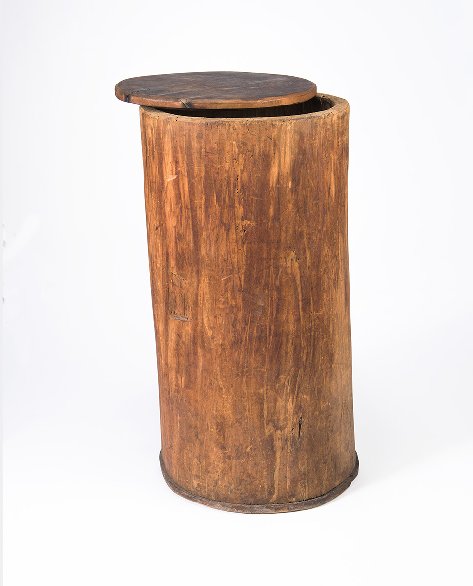 An old wooden barrel with a lid on it displayed at the Canadian Museum of History in Ottawa.