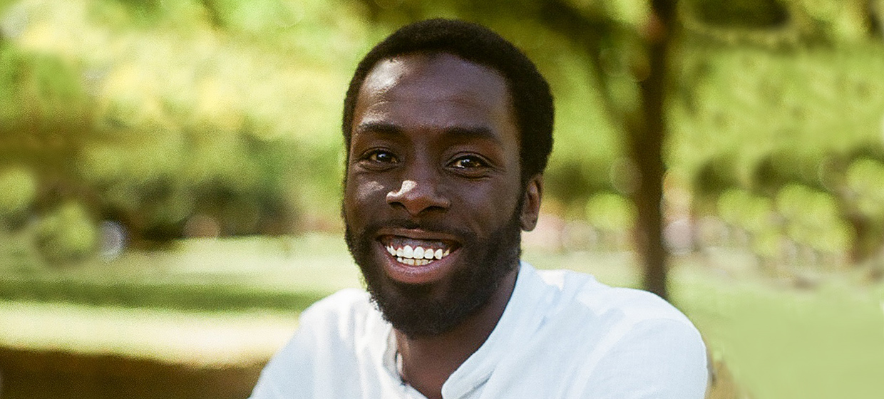 A man smiling in a park in Ottawa.