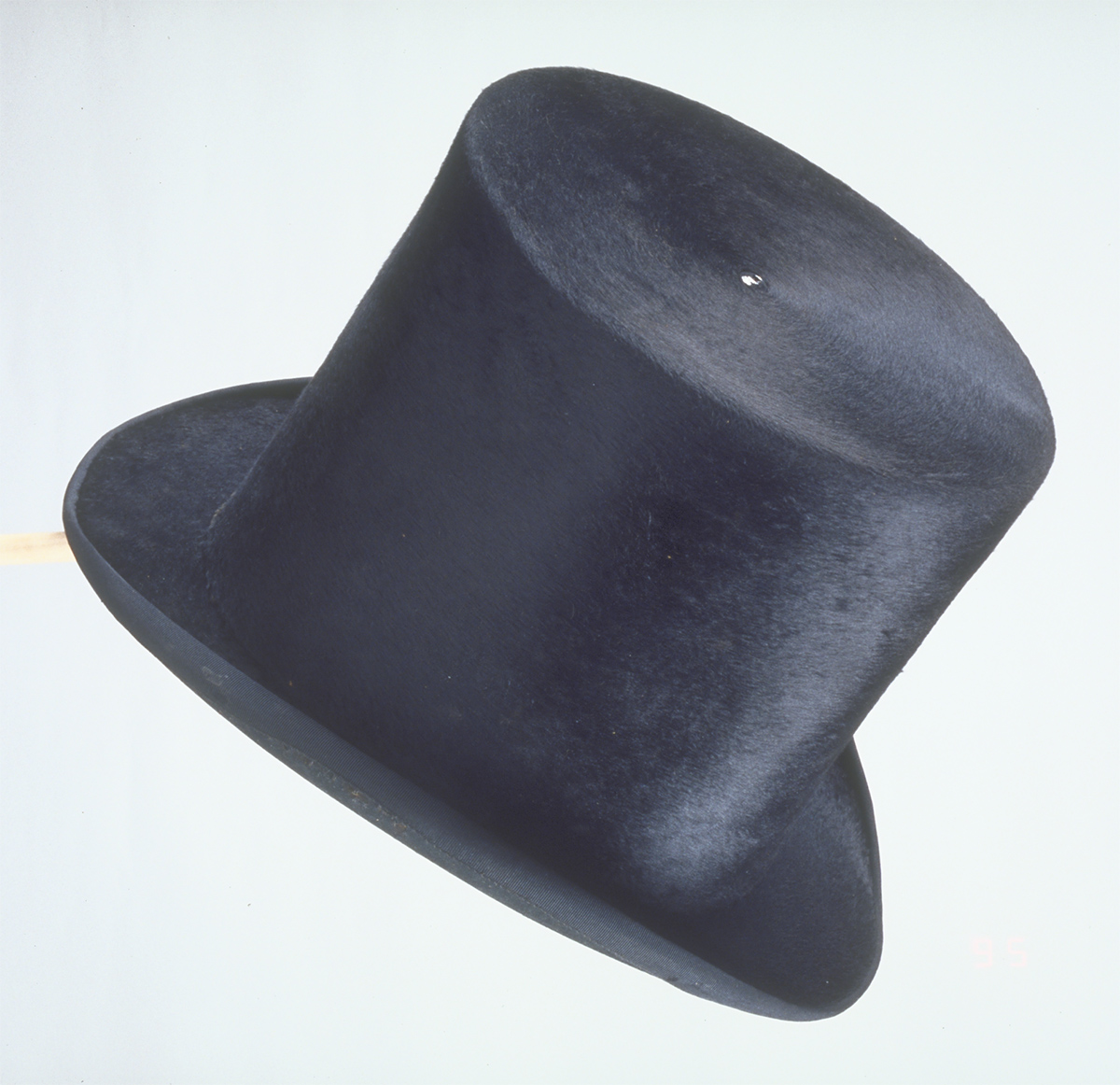 A black top hat on a stick displayed at the Canadian Museum of History in Ottawa.