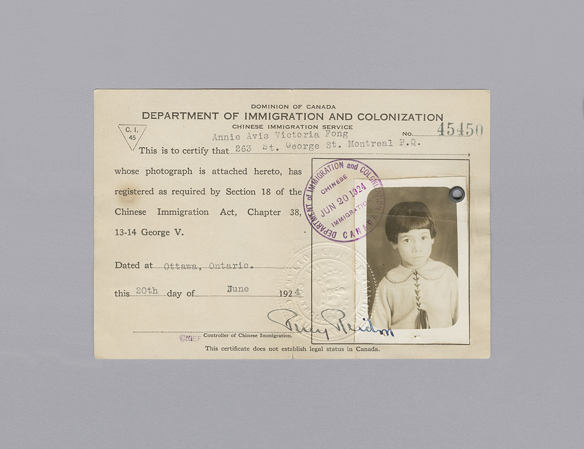 An old id card with a picture of a girl from Ottawa, displayed at the Canadian Museum of History.