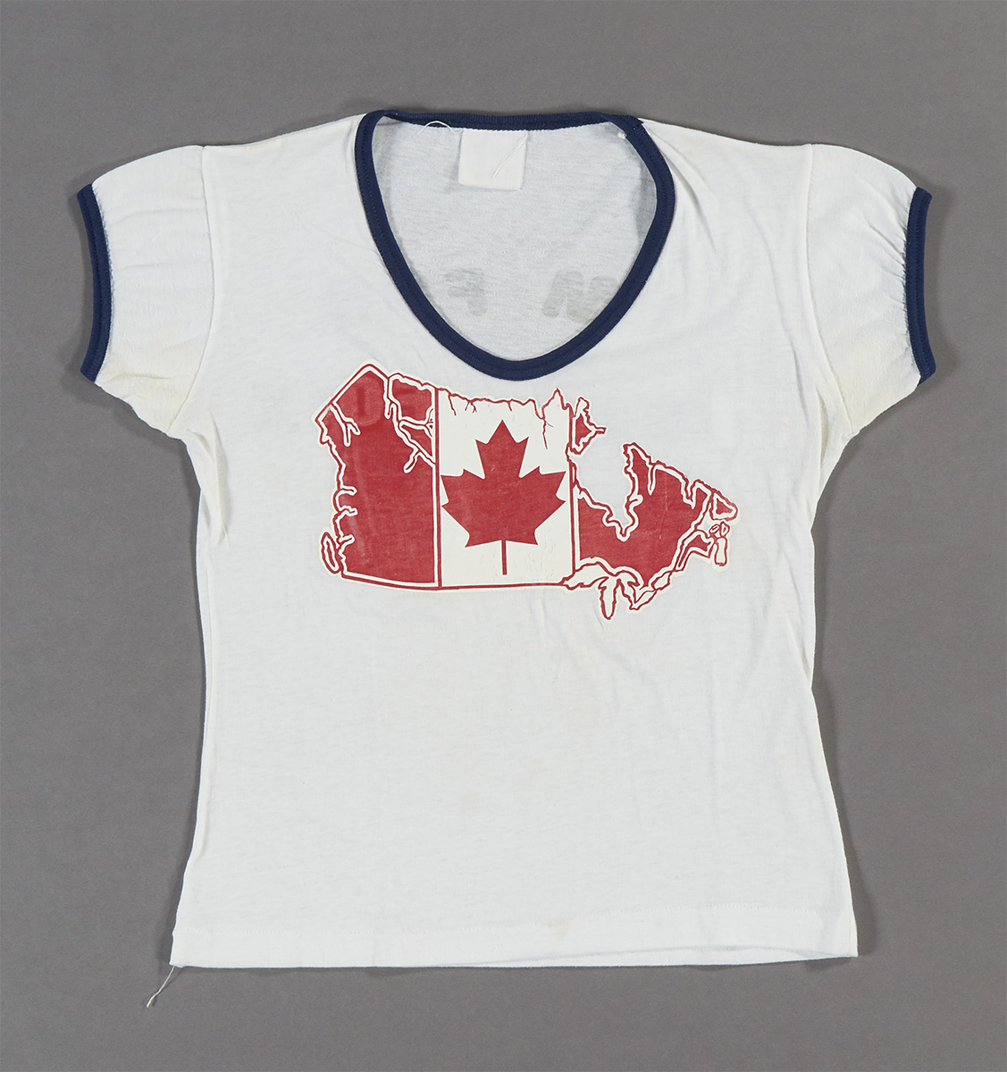 A white t-shirt with a Canadian flag on it, available at the Canadian Museum of History in Ottawa.