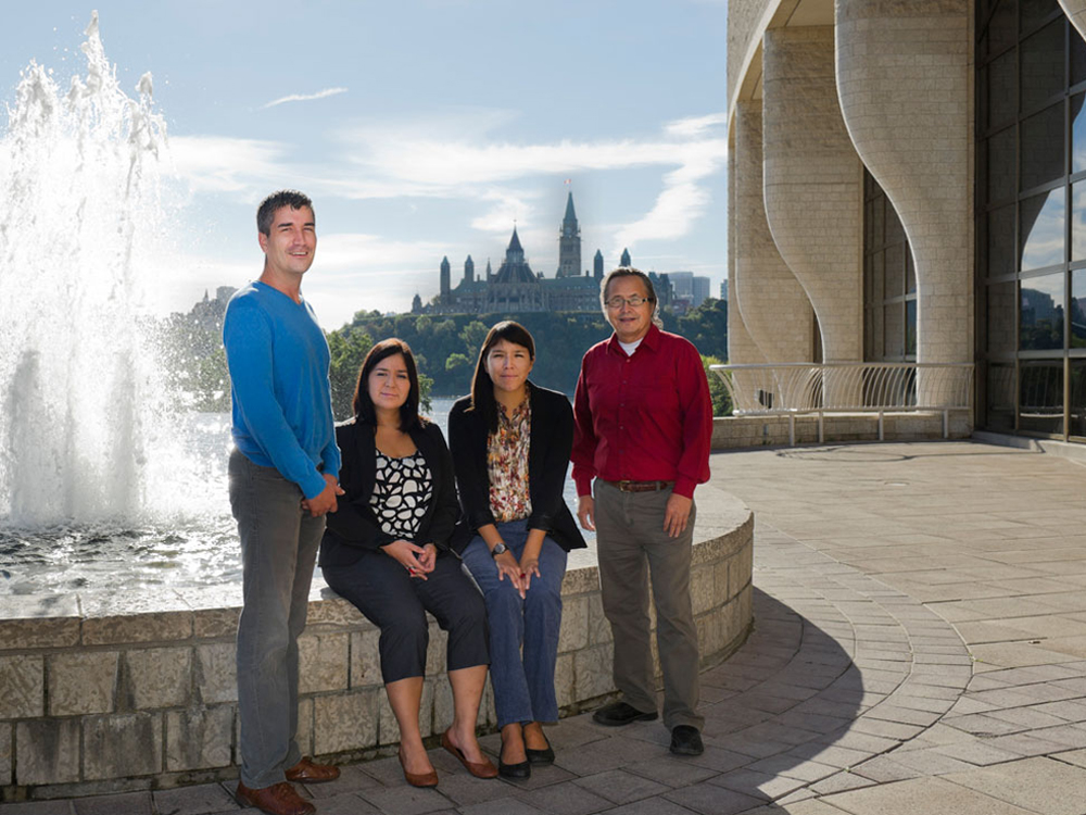 A group of people posing in front of a fountain at the Canadian Museum of History in Ottawa.