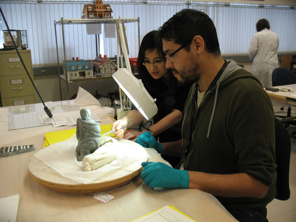 A man and a woman working on a sculpture at the Canadian Museum of History in Ottawa.