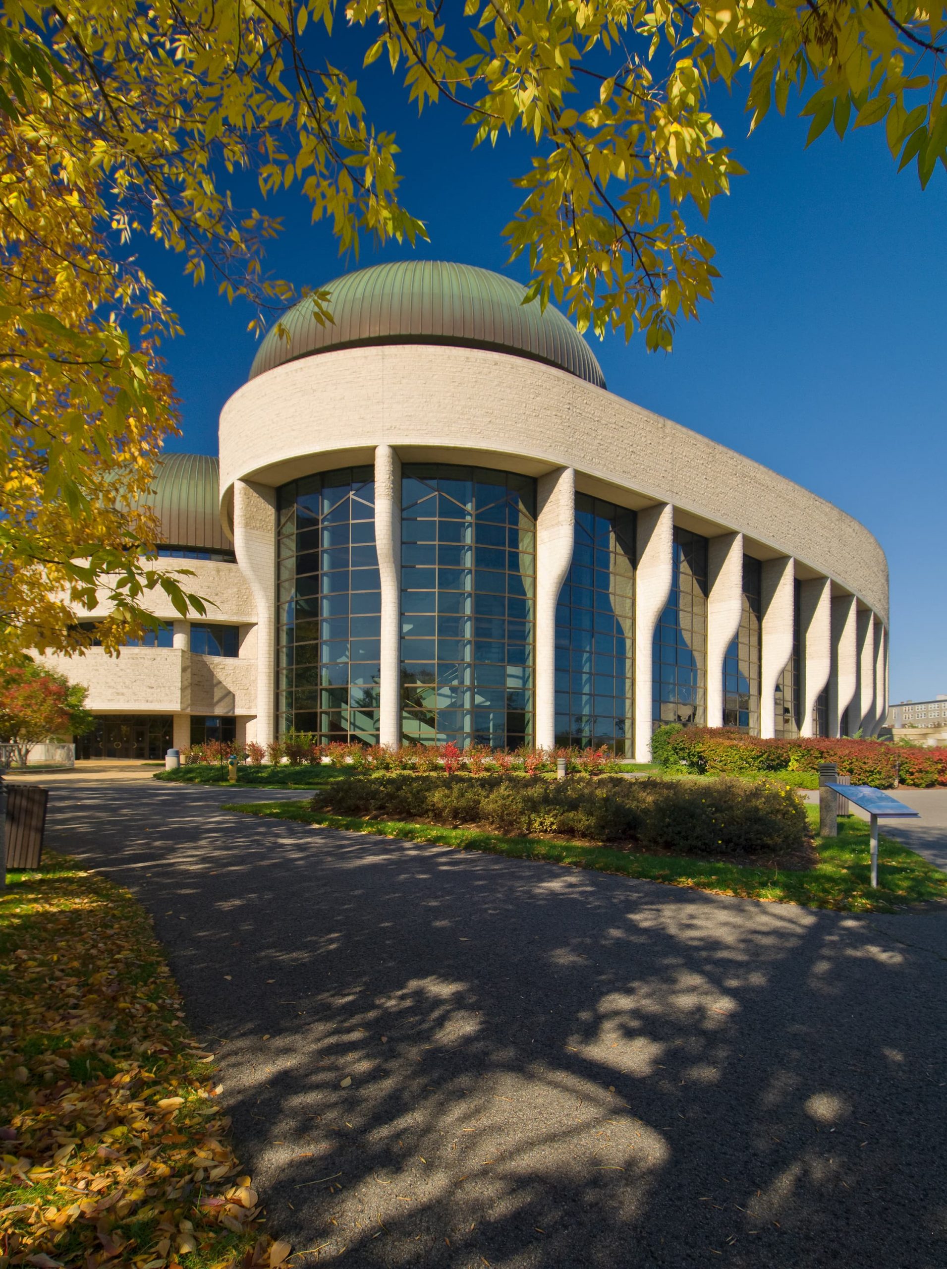 Located in Ottawa, the Canadian Museum of History stands tall as a white building.