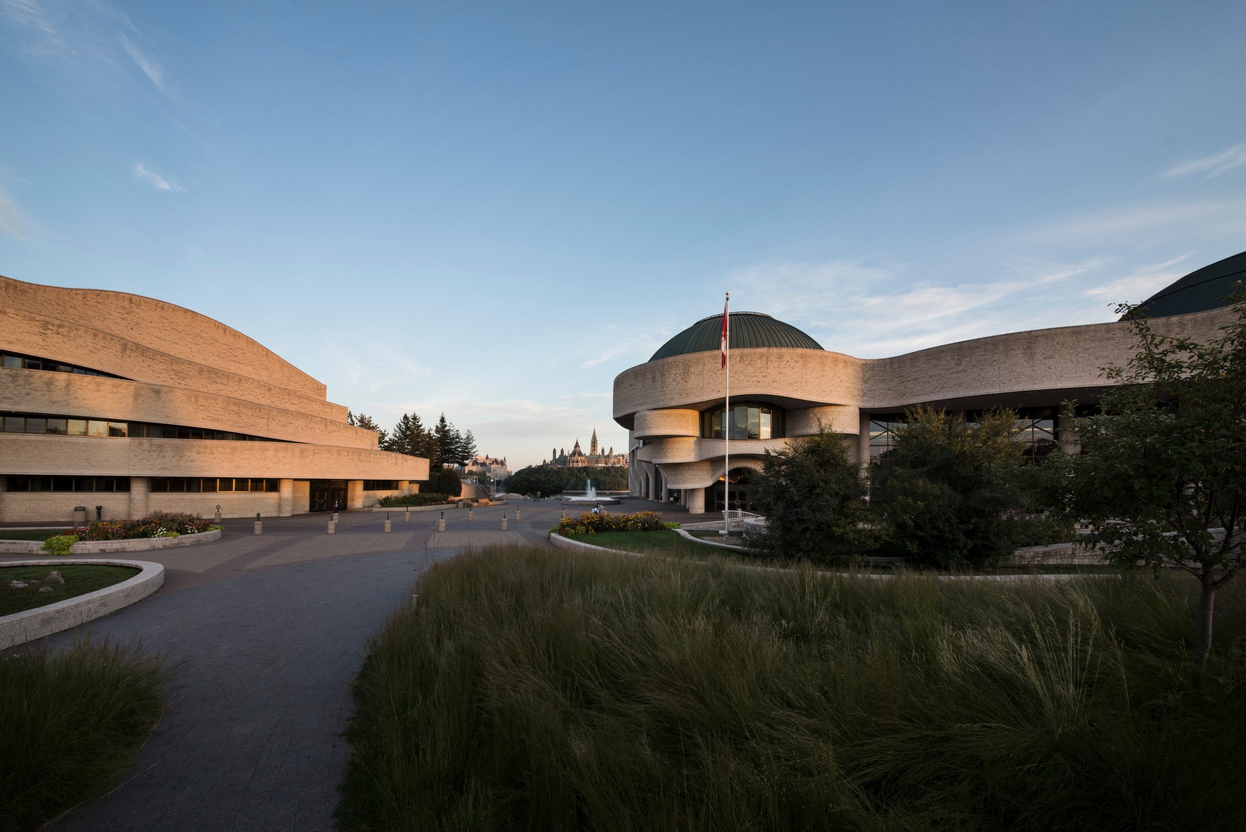 The Canadian Museum of History, located in Ottawa, is a large building with many domes in front of it.