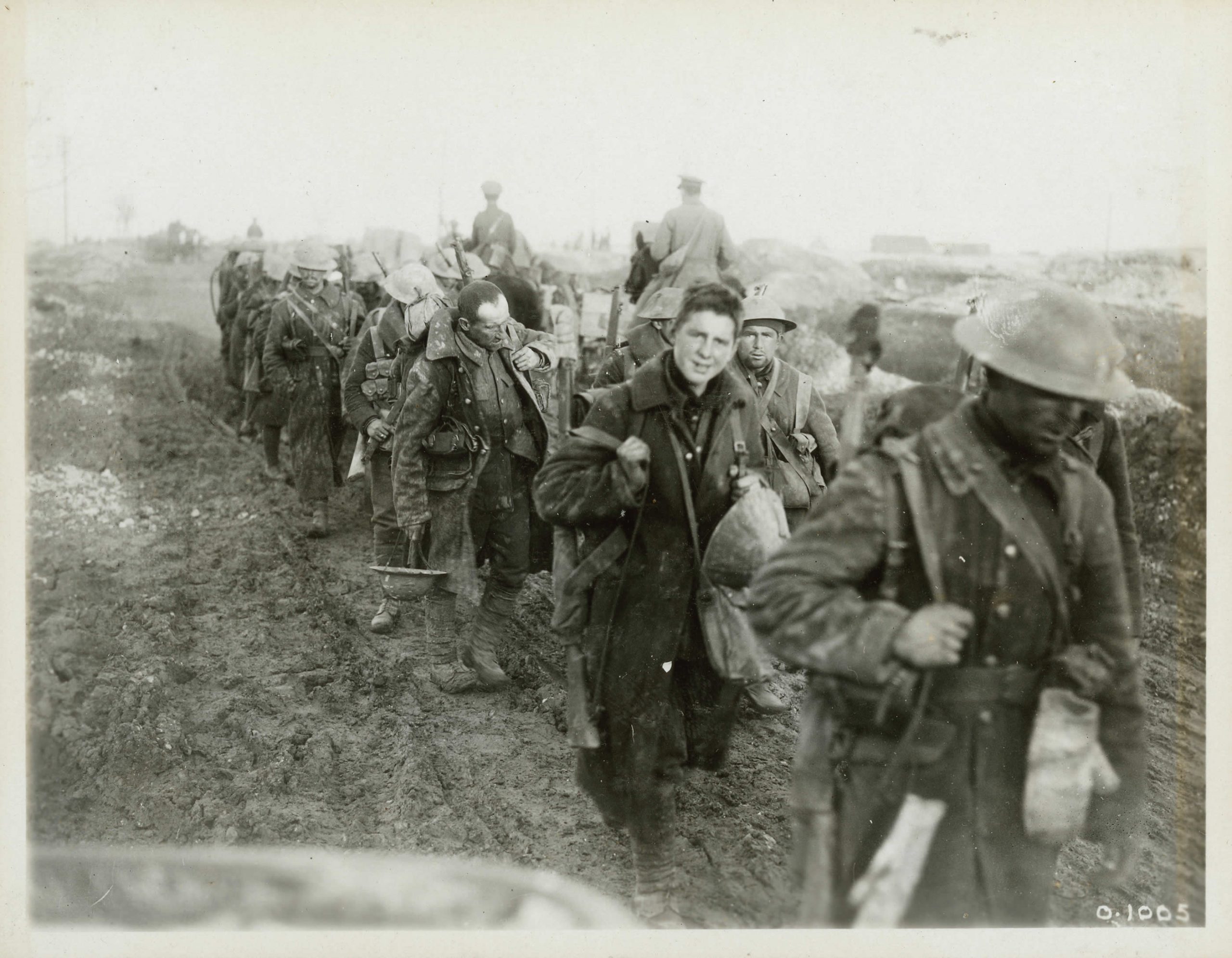 First world war soldiers walking down a muddy road