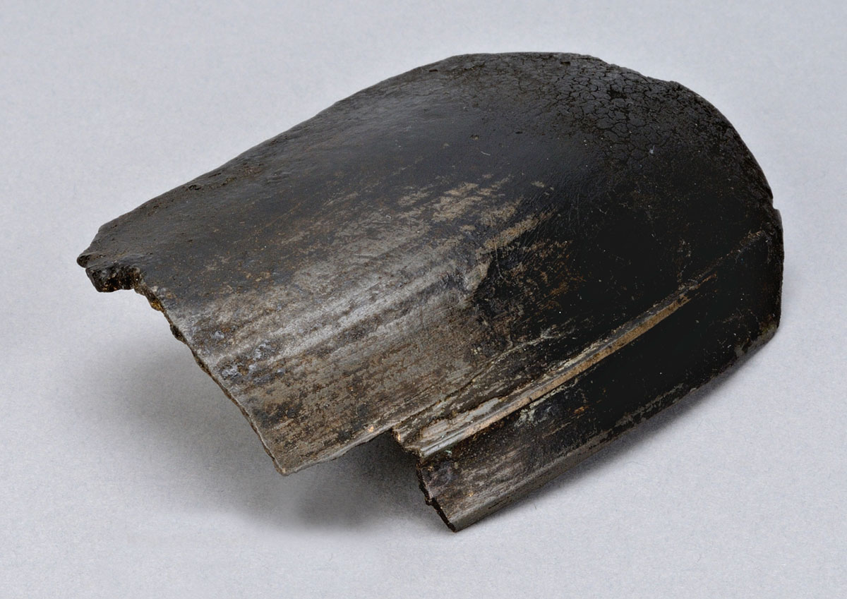 A black piece of wood on a white surface at the Canadian Museum of History in Ottawa.