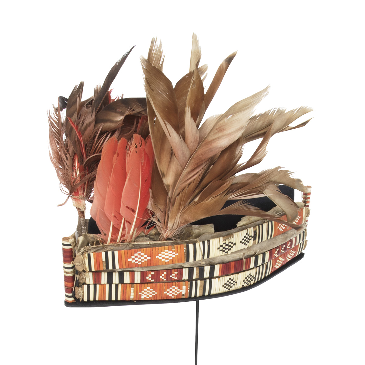 A hat adorned with feathers on top, displayed in the Canadian Museum of History in Ottawa.