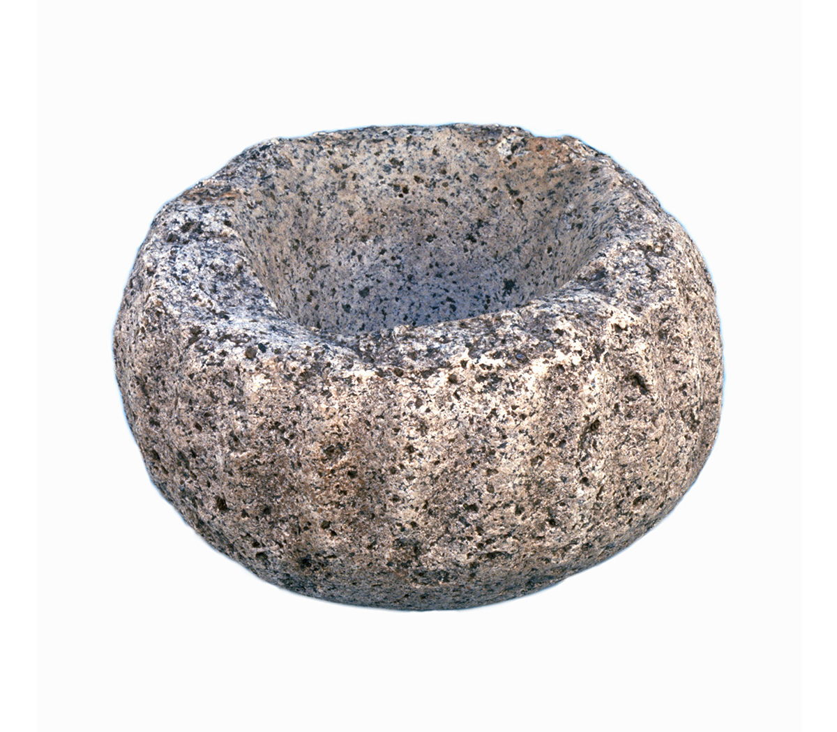 A stone bowl on a white background, showcased in the Canadian Museum of History.