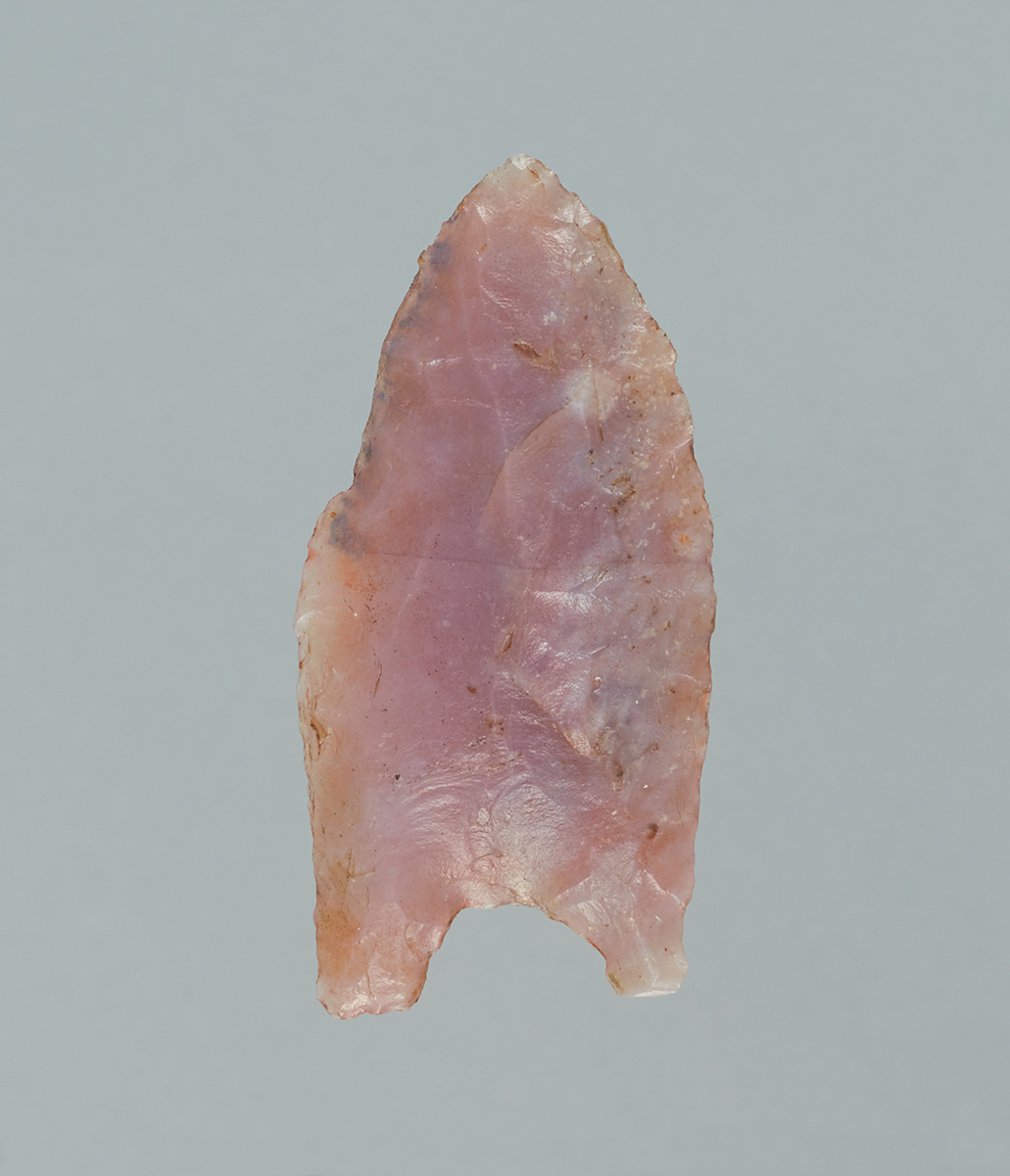 A pink arrowhead on a gray background displayed at the Canadian Museum of History in Ottawa.