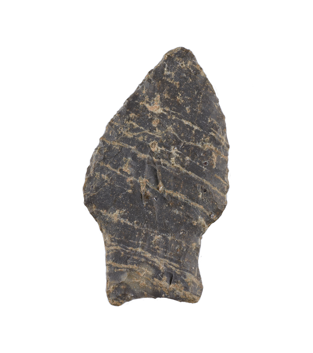 A stone arrowhead from the Canadian Museum of History, displayed on a white background in Ottawa.