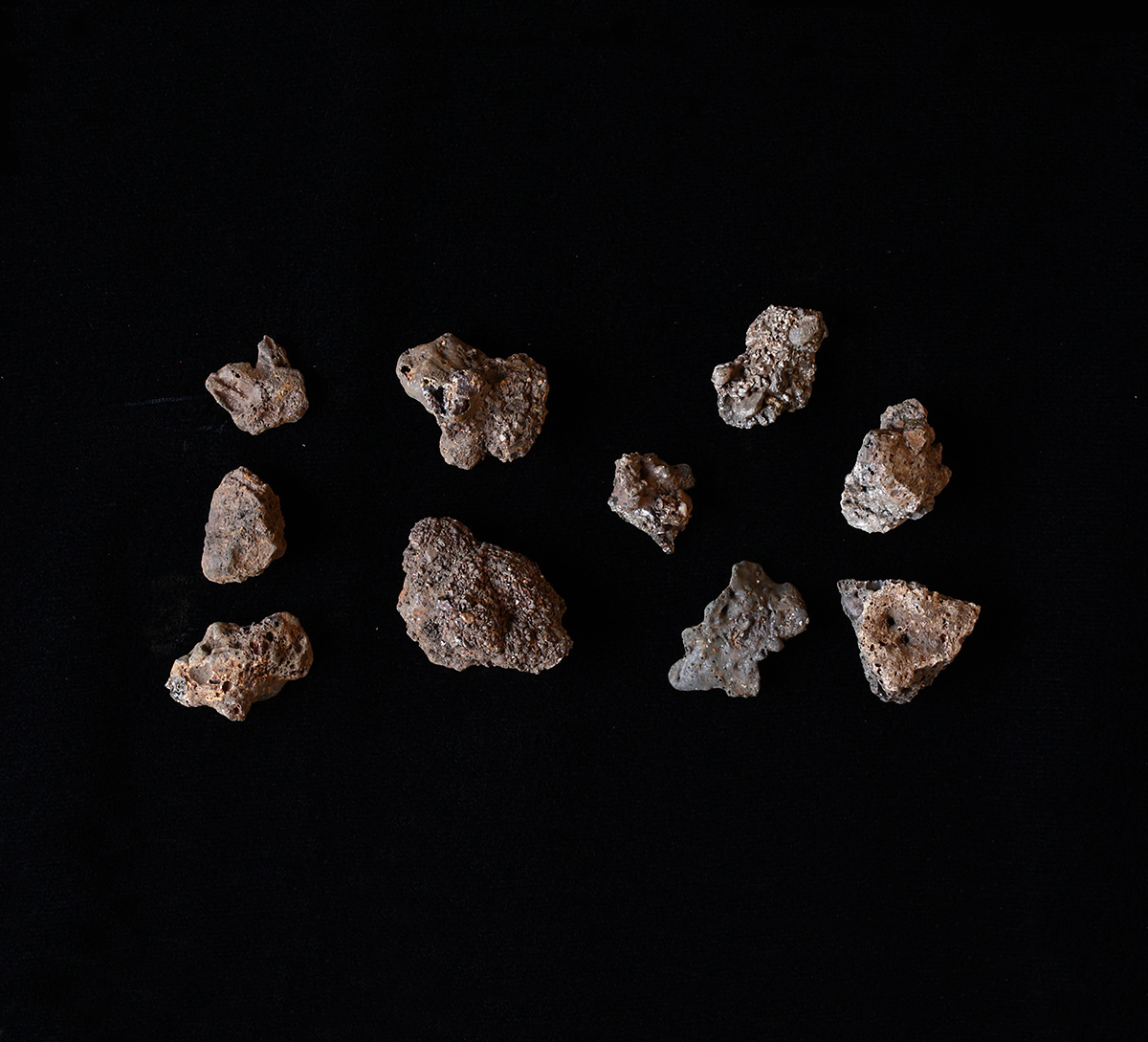 A group of rocks on a black surface at the Canadian Museum of History in Ottawa.