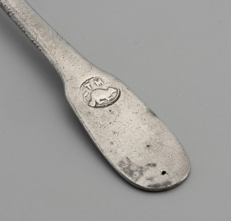 The beaver touch mark on the handle of a pewter spoon.