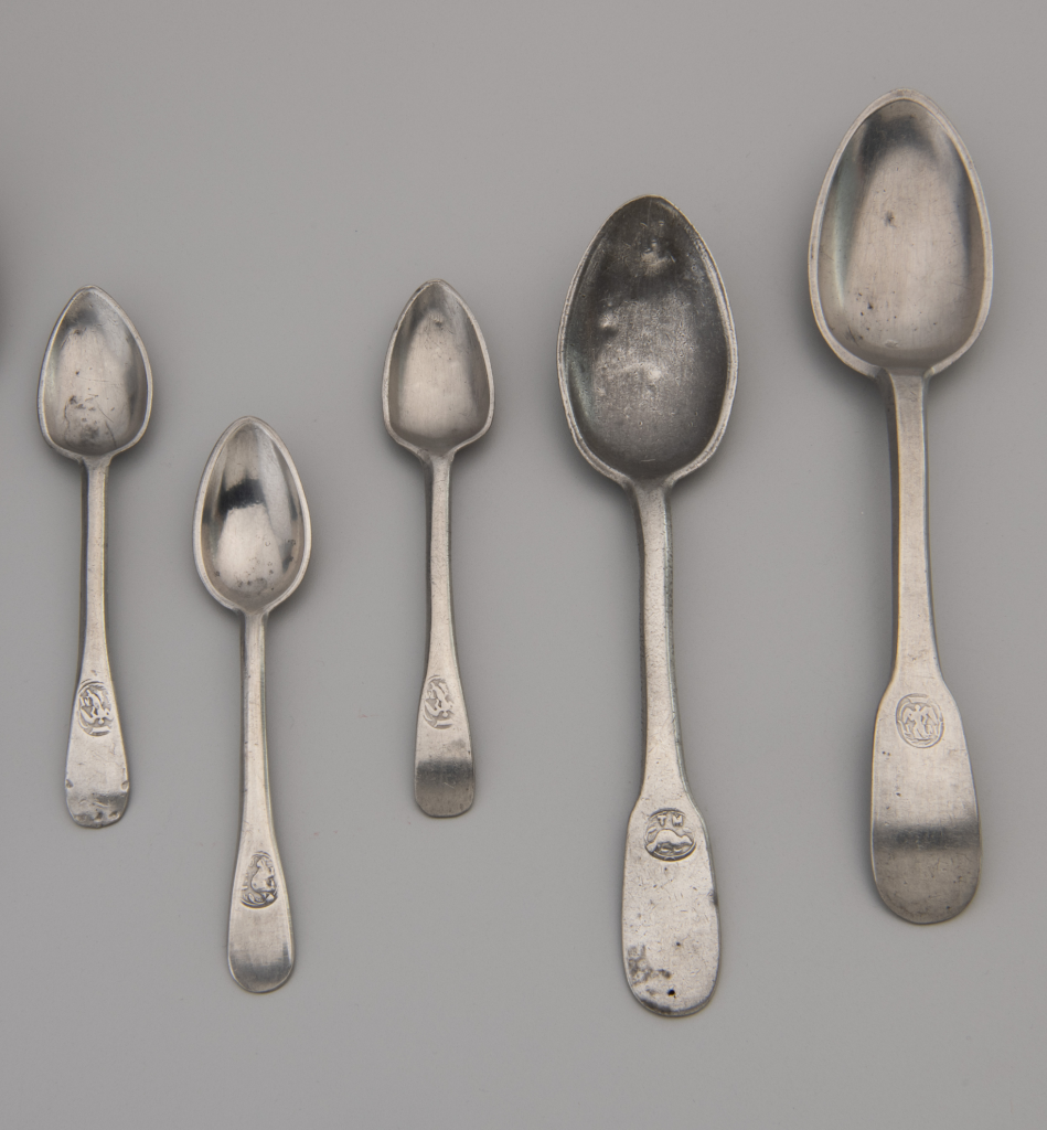 A row of silver spoons.