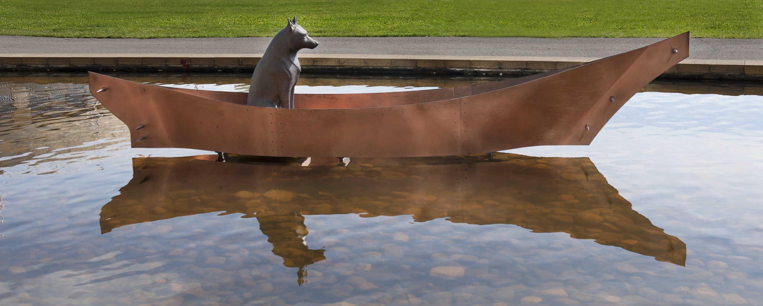 Statue of a wolf in canoe