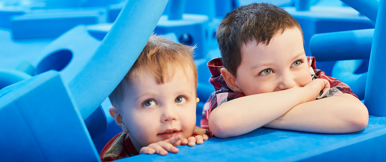 Children with life-sized blue foam blocks